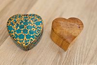 Both heart-shaped trinket boxes side by side