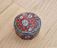 Top view showing floral enamel design and shape