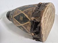 Full view of drum showing carved body and hide head