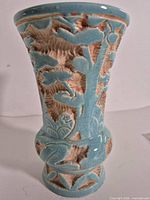 Full view of vase front showing shape and relief design