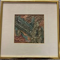 Full view of framed collage showing mat and gold frame