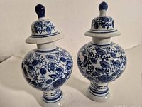 Full view of both porcelain ginger jars with lids