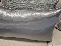Back side of pillow showing smooth satin finish