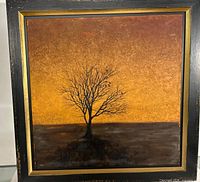 Full view of framed painting showing tree silhouette and textured sky