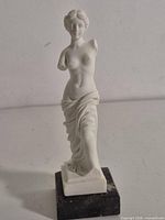 Front view of Venus de Milo statue on marble base