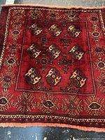 Full view of square Persian rug showing overall pattern and color