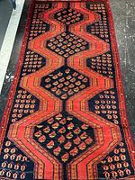 Full view of Persian runner showing medallion pattern and borders