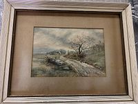 Full view of framed watercolor in ribbed frame