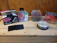 All storage media items grouped on wooden surface