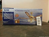 Sealed box showing Super 42" Decorative Ceiling Fan image and specifications