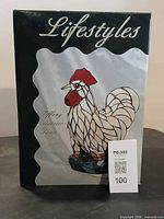 Front of sealed box showing Lifestyles Tiffany Rooster Lamp image