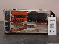 Overall view of tool kit in clear case showing all included tools and connectors