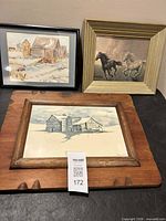 Group shot of three framed artworks