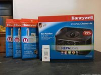 Front view showing Honeywell air purifier box and three filter packs