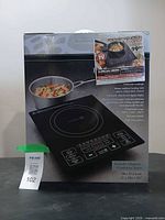 Front of box showing induction cooker image and included pot