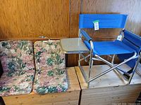 Chair and two cushions displayed on wooden chest