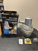 Box front showing Regent Dusk to Dawn 14,000 sq ft 70W sodium light and lamp housing