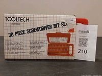 Front of boxed Tooltech 30-piece screwdriver bit set showing branding and contents