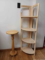 Corner shelf and pedestal table side by side