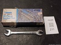 Boxed Mastercraft socket set and open-end wrench on surface