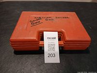 Closed orange Weller case exterior