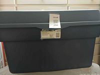 Front view of Rubbermaid Roughneck 114-L tote with lid