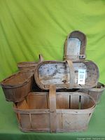 Stacked wooden slat fruit baskets showing sizes and handles