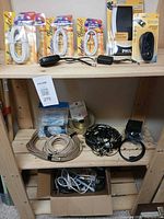 Overall lot on shelving showing packaged and loose cables
