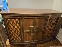 Front view of wood console stereo cabinet closed