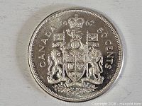 Reverse showing 1962 date, CANADA 50 CENTS legend and full coat of arms