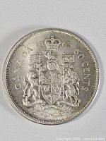 Reverse side displaying Canadian coat of arms and date 1965