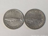 Two 1967 Canada silver dimes, reverse side showing mackerel design