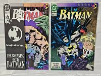 Three-view layout showing Batman #497 gatefold outer black flap, interior art, and Batman #496 cover