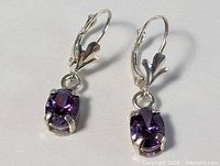 Full view of both sterling silver leverback amethyst earrings