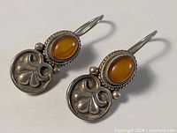 Full view of both earrings showing design details