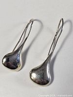 Front view of both sterling silver drop earrings