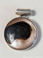 Front view showing cabochon pattern and silver bezel