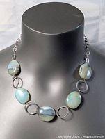 Full view of sterling silver necklace with stone beads displayed on bust