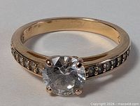 Top view of ring showing central solitaire crystal and channel-set shoulder crystals