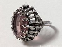 Side view showing prong setting and stone