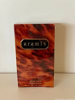 Front of sealed vintage Aramis after shave box showing branding and volume
