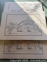 Stacked lithograph prints showing artwork and borders