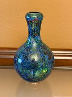 Full view of blue floral cloisonné vase front