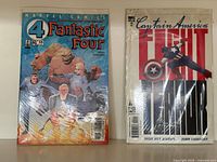Front view of both bagged comic books: Fantastic Four issue on left, Captain America: Fight Terror No.2 on right