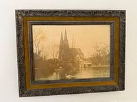Front view of framed sepia photograph