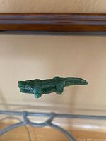 Side view of jade crocodile showing full body