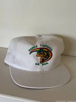 Full view of white Hawaii Football Na Koa cap