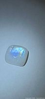 Front view of cushion cabochon moonstone showing blue flash