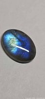 Top view of oval labradorite showing blue and gold flash