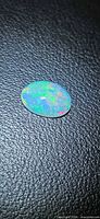Top view of oval opal showing play of color
